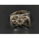 A 14K White Gold Diamond Ring with Raised Diamond Shoulders. 0.90ct and 0.40ct. H-VS Grade. Size