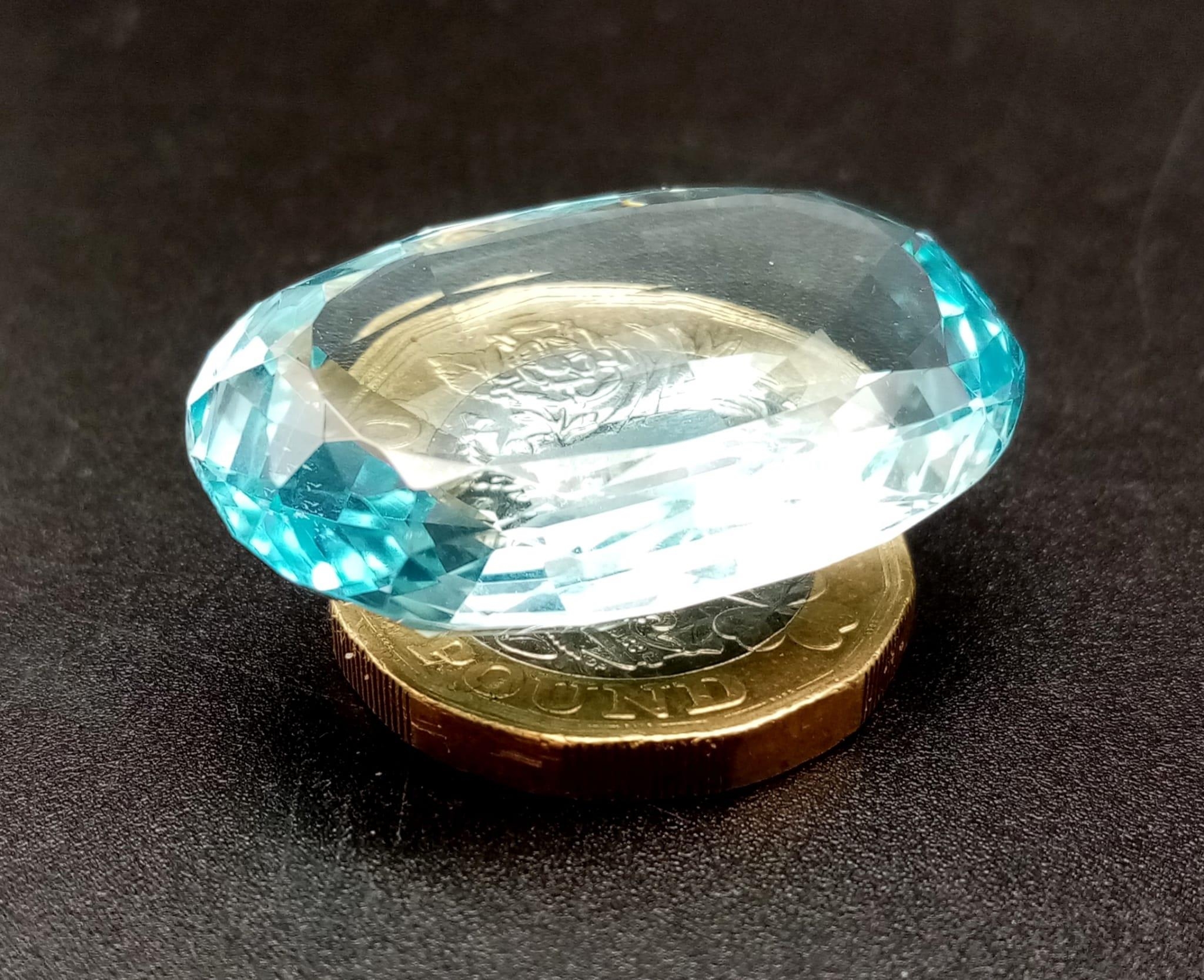 A 53.2ct Oval Aquamarine Gemstone. No visible inclusions to the naked eye. 10.68g. - Bild 5 aus 5