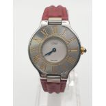A LADIES CARTIER SILVER WATCH WITH RED LEATHER STRAP AND ROMAN NUMERALS. 27mm