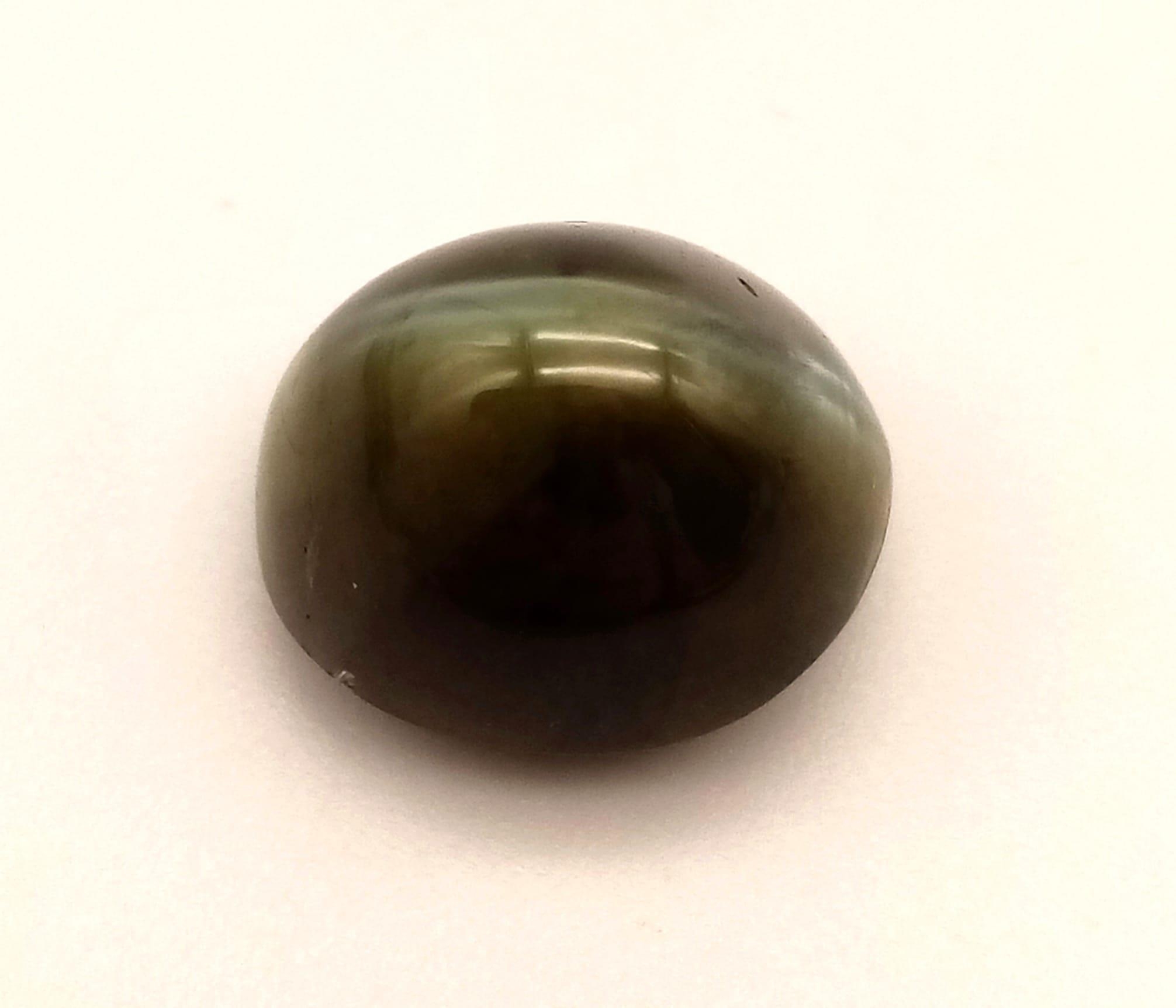 A 12ct Cats-Eye Chrysoberyl Gemstone. 2.4g 12x9x10mm - Bild 3 aus 5