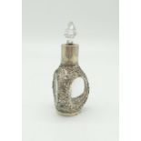 An Antique Chinese Sterling Silver Bottle with Crystal Glass Topper. Pierced Dragon and Flower