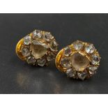 A Pair of 18K yellow Gold and Diamond Earrings. Flower-shaped with pistil central diamond surrounded