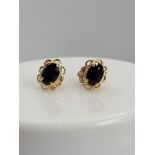 Pair of 9ct gold & black stone earrings,
