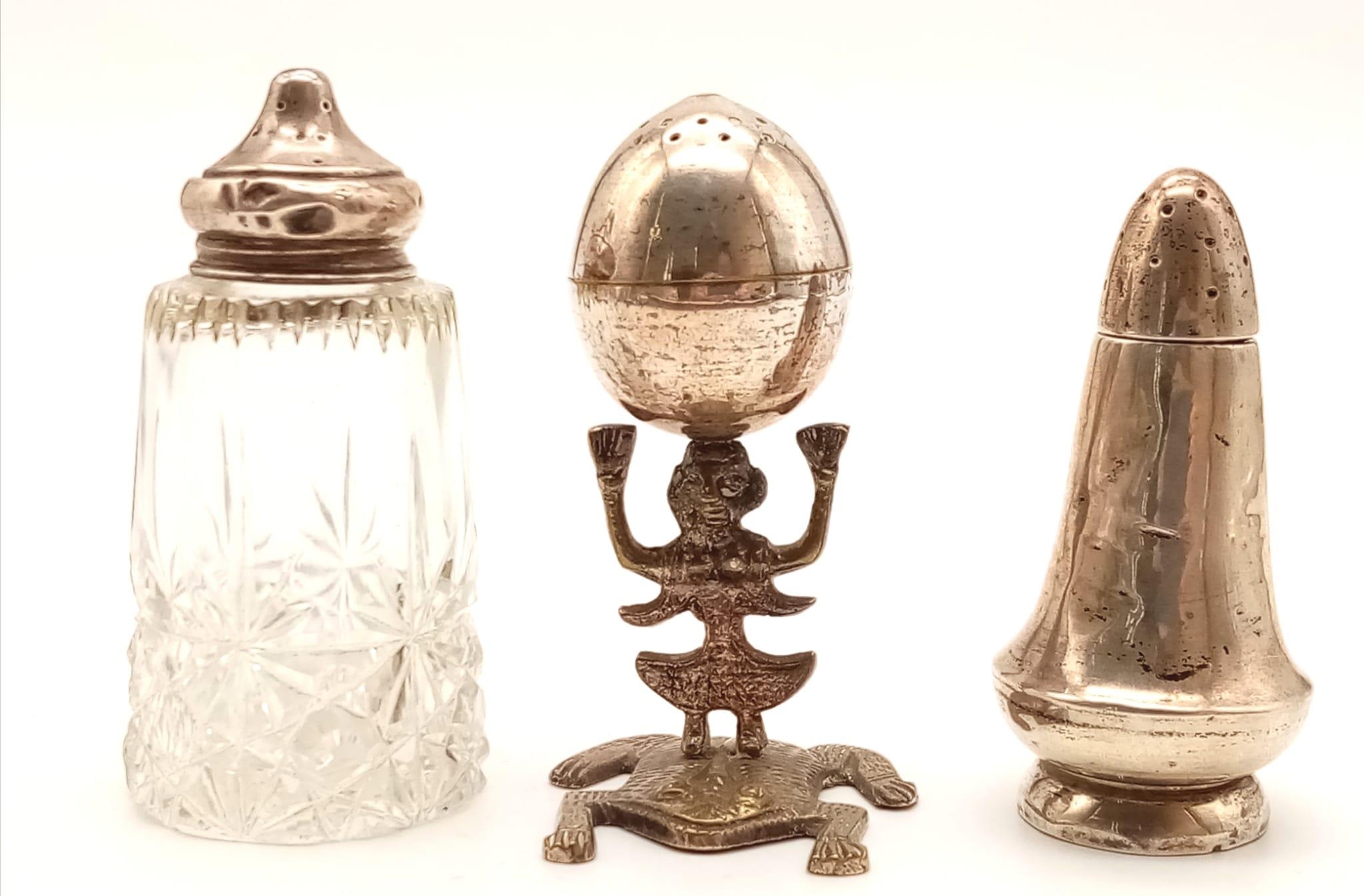 Three Antique Salt or Pepper Pots. One has a glass body. One is Peruvian, with a God and Frog