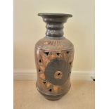 A Large Nigerian Stone (possibly terracotta) Vase. Pierced decoration. 61 x 28cm. We recommend the