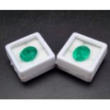 A pair of 8.72ct natural emeralds, oval cut, both have been enhanced, GIL certificates.