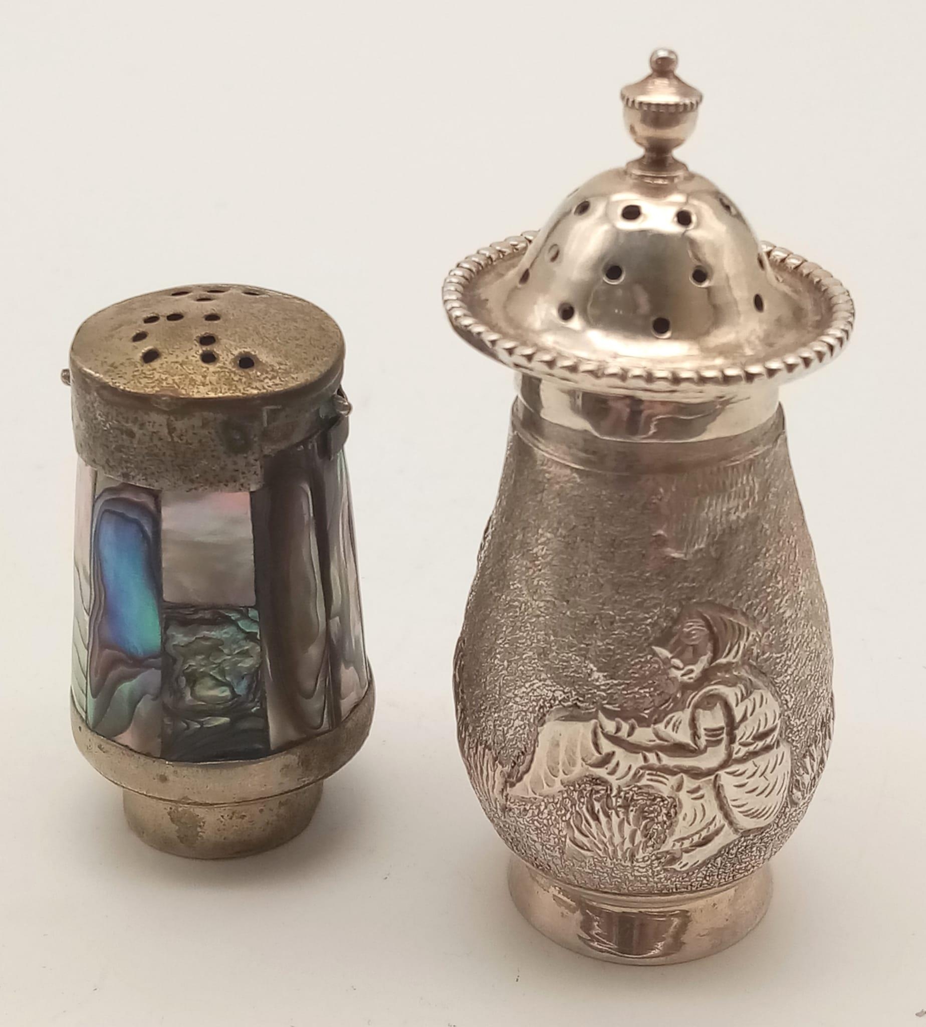 Two Antique Silver Cruets. One, Burmese, with a farm scene decoration. The other, decorated with