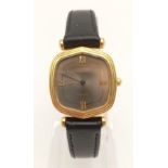 A Vintage 18K Gold Cased Longines Ladies Watch. Black leather strap with 18k gold case - 23mm x