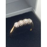 18 carat GOLD ring having four high grade DIAMONDS set to top in PLATINUM mount . Complete with ring