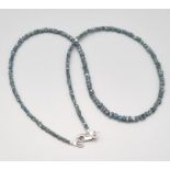 A 35cts, 16 inch raw rough natural blue diamond necklace.