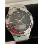 Casio WAVE CEPTOR multi function wristwatch, having black face and stainless steel bracelet.