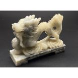 An Antique Soapstone Dragon Figurine. 13 x 10cm.