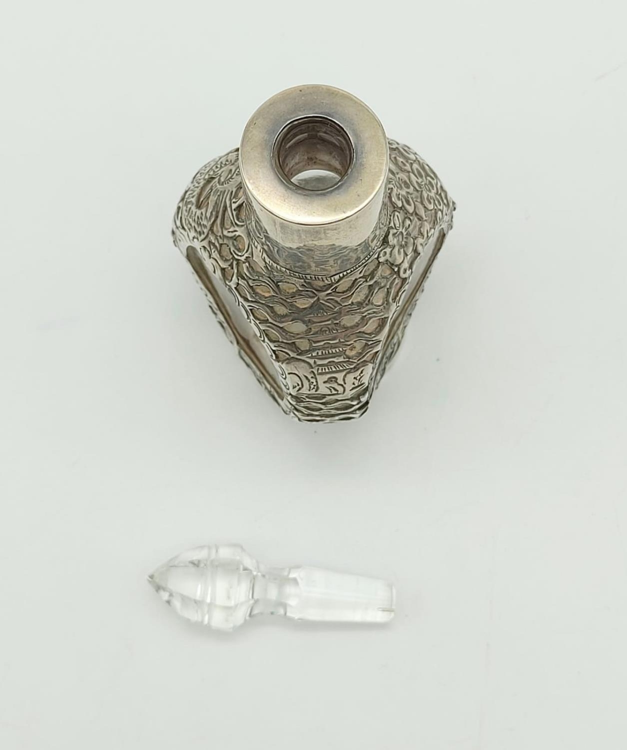 An Antique Chinese Sterling Silver Bottle with Crystal Glass Topper. Pierced Dragon and Flower - Image 5 of 6