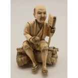 A 19th Century, carved ivory Japanese Okimono figure (signed). Height: 10.6 cm, weight: 158 g.