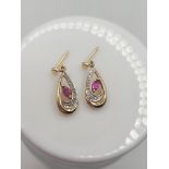 Pair of 9ct & diamond earrings