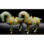A Pair of Chinese Tang Dynasty War Horse Statues. Bronze with gold leaf decoration throughout.