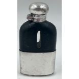 An Antique White Metal and Leather Small Hip Flask. Glass interior. Very good condition. 10x 5.3cm.