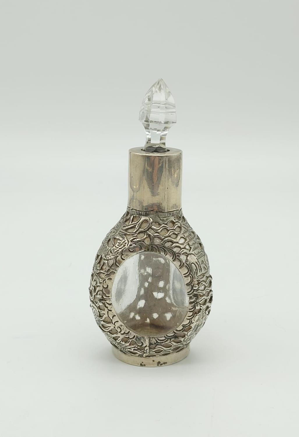 An Antique Chinese Sterling Silver Bottle with Crystal Glass Topper. Pierced Dragon and Flower - Image 2 of 6