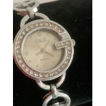 Ladies Quartz wristwatch in silver tone having circular face with jewellled bezel and Stainless