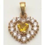 18K YELLOW GOLD STONE SET HEART PENDANT. TOTAL WEIGHT 2.8 GRAMS