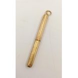 An Early 18K Yellow Gold Retractable Propelling Pencil with Original Pendant Loop. 5cm. 2.9g