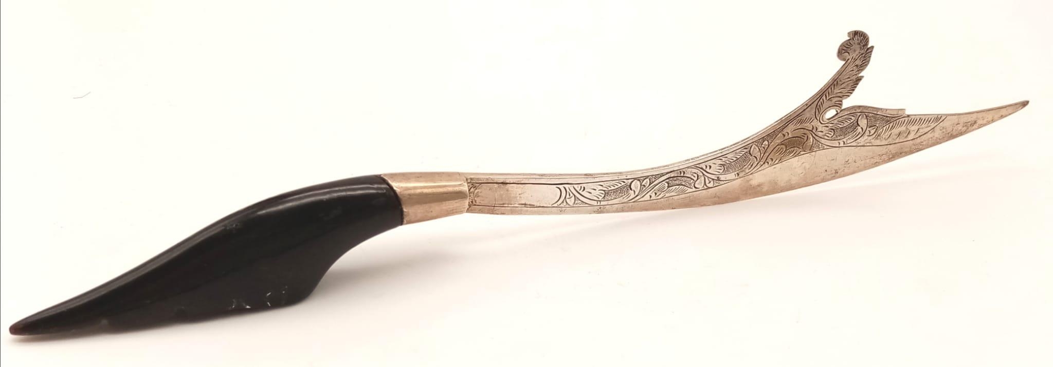 An Antique Solid Silver Islamic Letter-Opener. Possible horn handle. Islamic hallmarks. 25cm. 43g