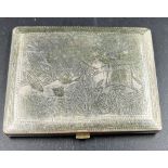 An Antique Indian Solid Silver Cigarette Case. Engraved with images of elephants and lions. Hinge