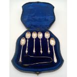 An Antique Mixed Solid Silver Teaspoons Lot. Four with a religious symbol handle. Sugar nips also