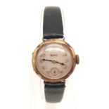 A Vintage Doxa 9k Gold Ladies Watch. Black leather strap. 9K Gold case - 20mm. White dial with