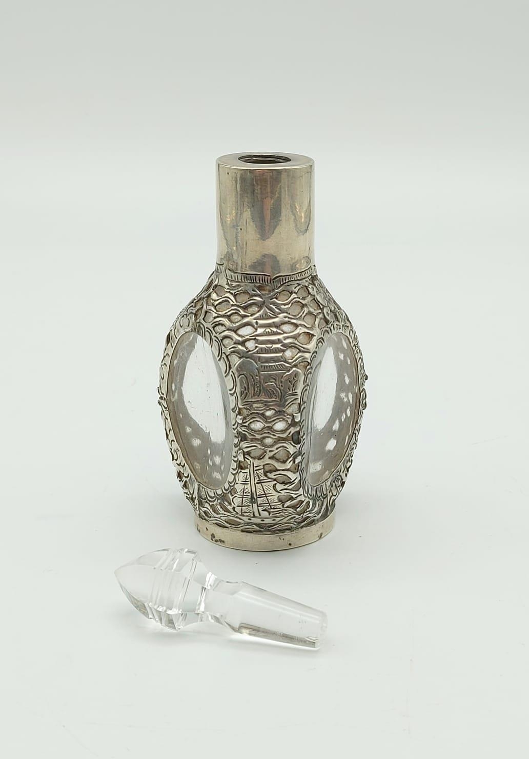 An Antique Chinese Sterling Silver Bottle with Crystal Glass Topper. Pierced Dragon and Flower - Image 4 of 6