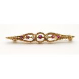 9K YELLOW GOLD DIAMOND & RUBY BROOCH. TOTAL WEIGHT 3.2 GRAMS