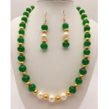 A beautiful, large beaded, emerald necklace and earrings set with natural pearls and 18 K yellow
