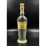 A Bottle of 1970s 100% Proof Pierre Smirnoff Vodka. No. 11931. 26 and 2/3 fluid ounces. 33cm tall.