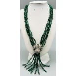 A rarely seen necklace with six rows of emeralds in their natural state (no heat treatment, no