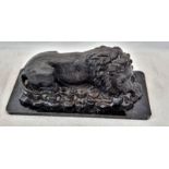 A Vintage, Possibly Antique Bronze Sculpture of a Resting Lion. Black patinated finish. Black marble