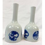 A pair of Oriental blue and white porcelain vases with dragon motifs and microbubble glazing which
