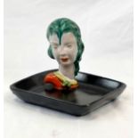 A Vintage Goldscheider Black Trinket Dish With A Green-Haired Female Head. Has been damaged and