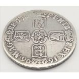 A 1696 William III Silver Crown Coin. Please see photographs for conditions. 29.25g.