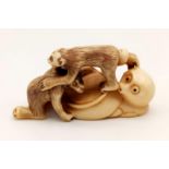 An Antique 19th Century Japanese Ivory Netsuke Monkey Figurine. Signed on base. 5.5cm.