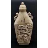 A 19th Century, carved ivory snuff bottle from the Orient. Unusual shape, good engraving and