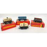 Four Hornby Railways Model Train Wagons: R 015 Milk, R240 GWR, R007 UD Milk and R220 Norstand. As