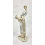 A Lladro porcelain figure of a mother and child. Hand made and hand painted in Spain. Height: 33.5