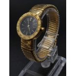 A Bvlgari 18K Yellow Gold Ladies Watch. Gold bracelet and case - 24mm. Black dial. Quartz