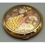 A Vintage Gilded Peacock Design Compact by Stratton. 8cm diameter.