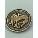 Large USA SILVER DOLLAR converted to a brooch with the word ?mother? applied in GOLD to one side.