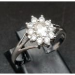 A 9 K white gold ring with a cluster of cubic zirconia. Ring size: P/Q, weight: 1.79 g.