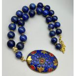 An Ethnic lapis lazuli necklace with a large pendant with lapis lazuli and red coral. Necklace