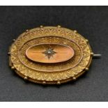 A Victorian, 15 K yellow gold brooch locket with a seed pearl at centre. Dimensions: 31 x 22 x 5 mm,