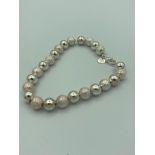 Silver boules bracelet having plain and frosted silver balls with 925 silver tag. 7? (18cm).