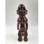 A 19th Century carved ivory figure of a man with beaded necklace, from Lega tribe, Congo. Height: